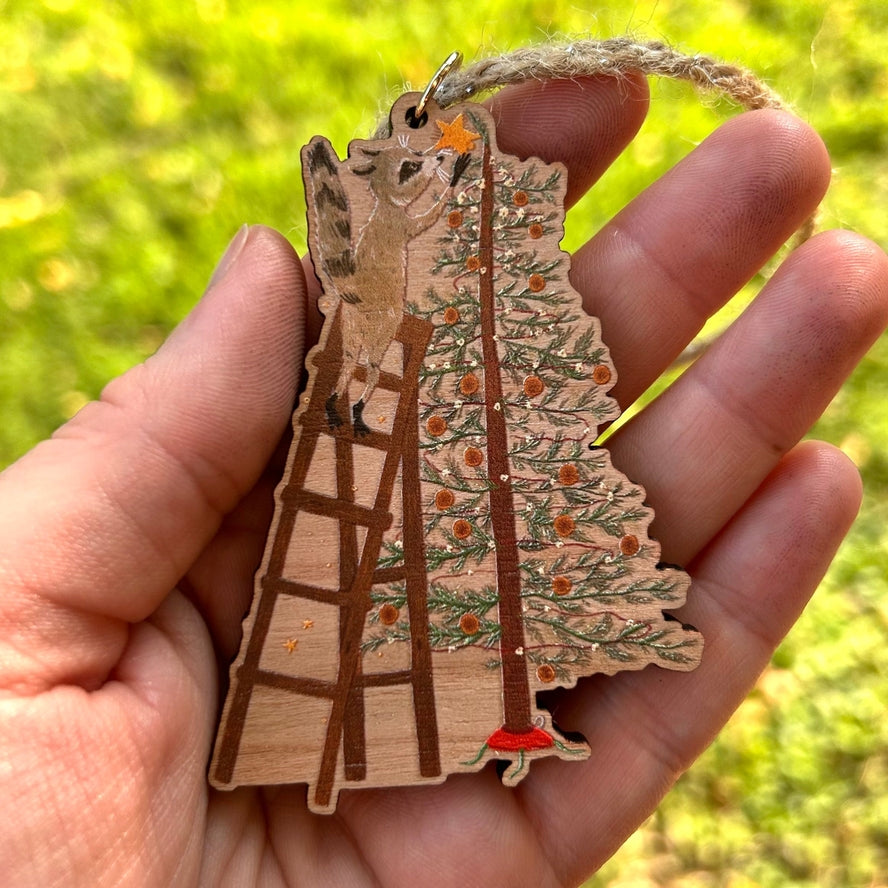 FESTIVE RACCOON WOODEN HOLIDAY ORNAMENT